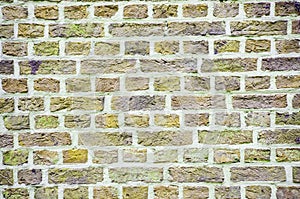 Textured wall of yellow bricks, detailed background