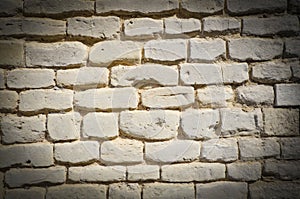 Textured wall of yellow bricks, detailed background