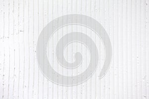 textured white background with plaster vertical lines and stripes