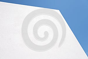 Textured White concrete background on blue sky background