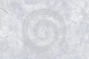 Textured white marble surface with subtle gray veins