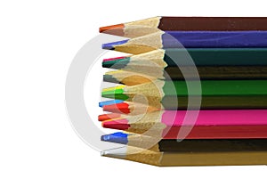 Textured wood colored pencils. Colored pencils macro. Assortment of colored wood drawing pencils on white background