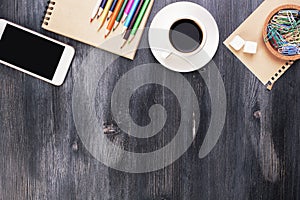 Textured wooden desk with items