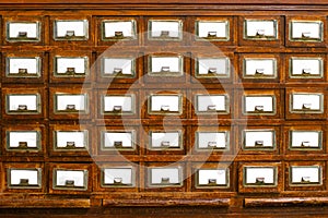 Textured wooden vintage file cabinets with empty spaces for text