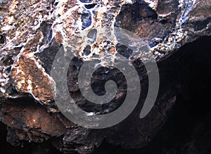 TEXTURES AND HOLLOWS ON A LARGE ROCK