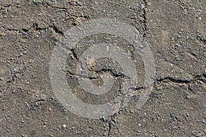 Grey clay, concrete wall with cracks