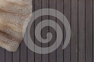 Textures red fox fur on wooden background. Top view