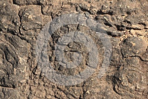 textures showing the formation of stone from ancient cooled lava flow on rock faces in a volcanic area rural Victoria