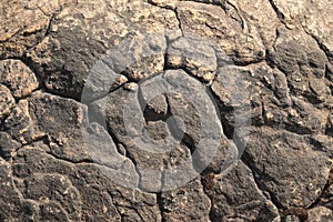 textures showing the formation of stone from ancient cooled lava flow on rock faces in a volcanic area rural Victoria