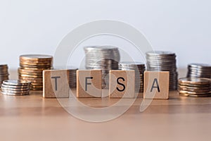 TFSA Tax Free Saving Accounts signs with coins in the background