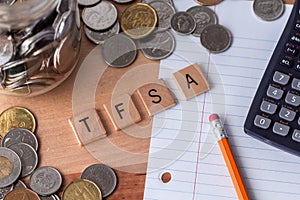 `TFSA` Tax Free Savings Account spelled out in wooden letter tiles