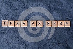 `TFSA vs RRSP` spelled out in wooden letter tiles photo