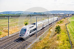 A TGV Duplex high-speed train in the french countryside