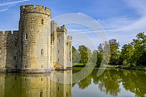 14th century Bodium castle surrounded by a moat in the County of Sussex in England.