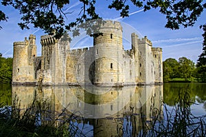 14th century Bodium castle surrounded by a moat in the County of Sussex in England.