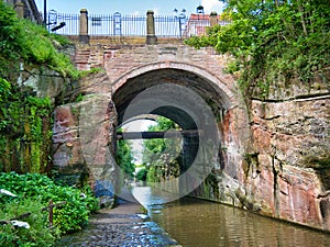 The 18th century, coursed red sandstone Northgate Street Bridge over the Shropshire Union Canal in Chester, Cheshire, UK.