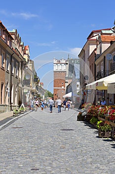 14th century gothic entrance Opatowska Gate, view of Opatowska Street, Sandomierz, Poland