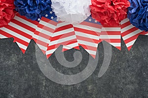 4th of July background. USA paper fans, Red, blue, white stars, balloons, gold confetti on gray dark concrete background. Happy