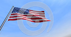 4th July CGI isolated USA flag waving on a blue sky - close up of United States of America national flag flowing in the wind in US