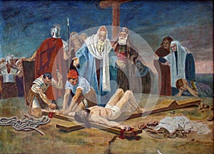 11th Station of the Cross - Crucifixion: Jesus is nailed to the cross photo