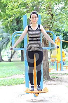 Thai adult beautiful girl doing exercises in the park