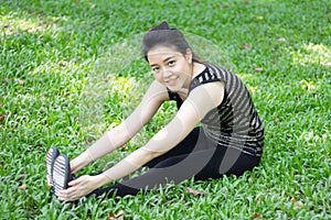 Thai adult beautiful girl doing yoga exercises in the park