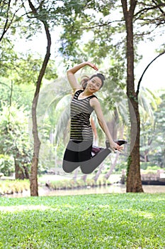 Thai adult beautiful girl relax and smile in the park