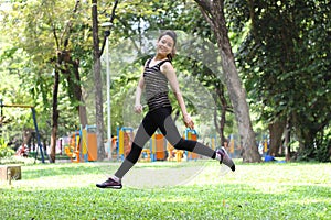 Thai adult beautiful girl relax and smile in the park