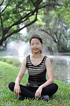 Thai adult beautiful girl relax and smile in the park