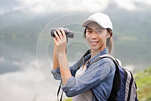 Thai adventure girl happy with her bird wathcing