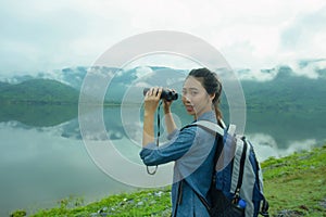 Thai adventure girl happy with her bird wathcing