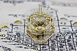 Thai amulet ring on background