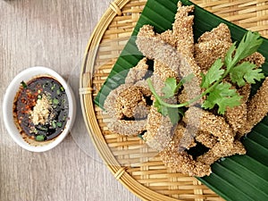 Thai appetizers menu pork deep fries with Thai spicy sauce. So decorate traditional foods of Thai South Eastern.