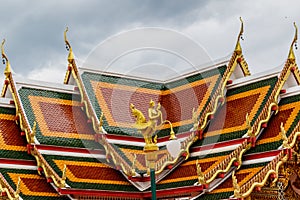 Thai art on roof Church at phathat Cheung choom woravihan temple