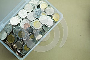 Thai baht silver and gold coins closeup in box