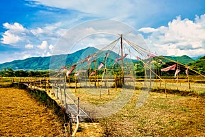 Thai bamboo walking path and bridge with beautiful sky and forrest background