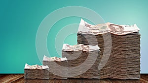 Thai banknote on wooden table with green background