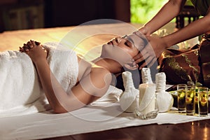 Thai body spa massage with aroma herbs., Pretty attractive asian woman is relaxing by beauty skin care after traveling in Thailand