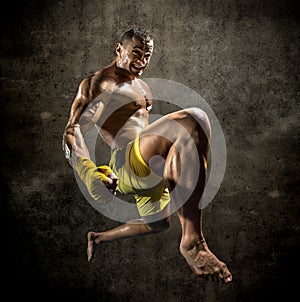 Thai boxer  jump and kicking