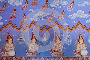 Thai buddhist paintings of dieties on the temple walls