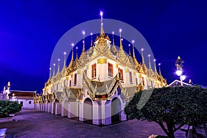 Thai buddhist temple illuminated at dusk