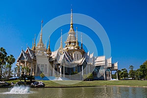 Thai buddhist temple wat near the pond