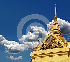 Thai chedi over blue sky