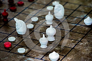 Thai Chess Figure on Checkerboard photo