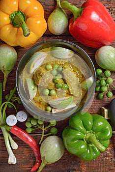 Thai chicken green curry with old wooden table