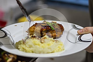 Thai chicken and rice on white plate