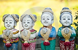 Thai children stucco doll salute.