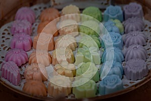 Thai coconut cookies or Khanom Sam Pan Nee, Made of tapioca flour, coconut cream and sugar serving in a Bamboo basket hand made