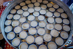 Thai coconut milk custard Khanom Thuai steaming in the white cup