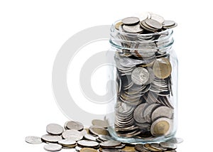 Thai coins in a glass jar